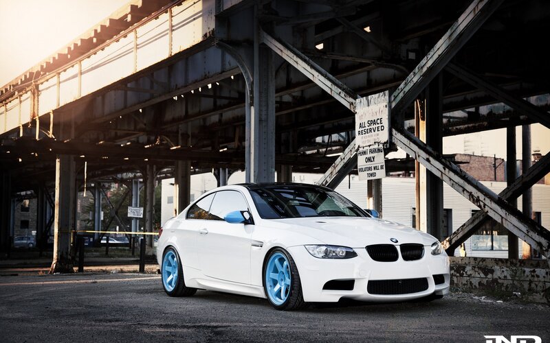 white bmw m3 under bridge