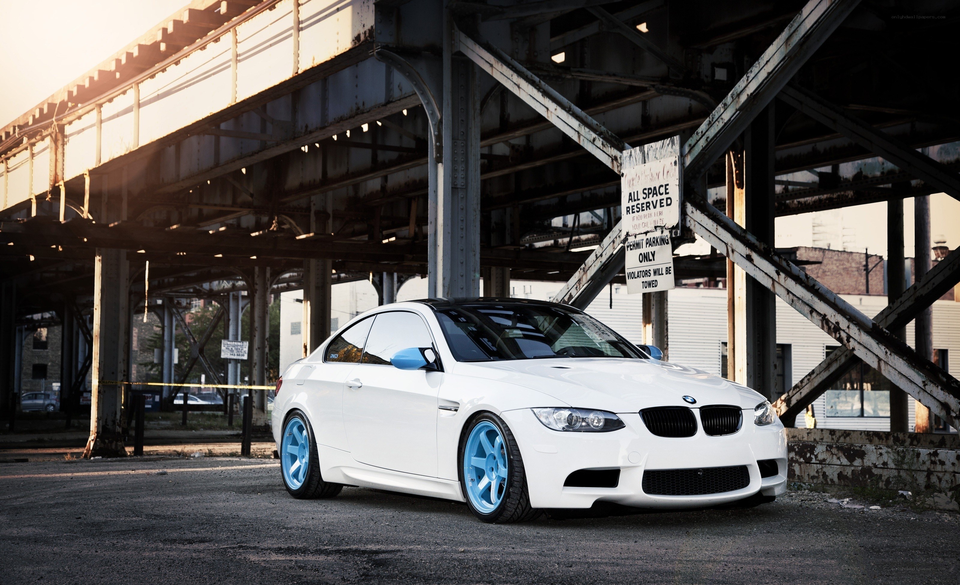 white bmw m3 under bridge