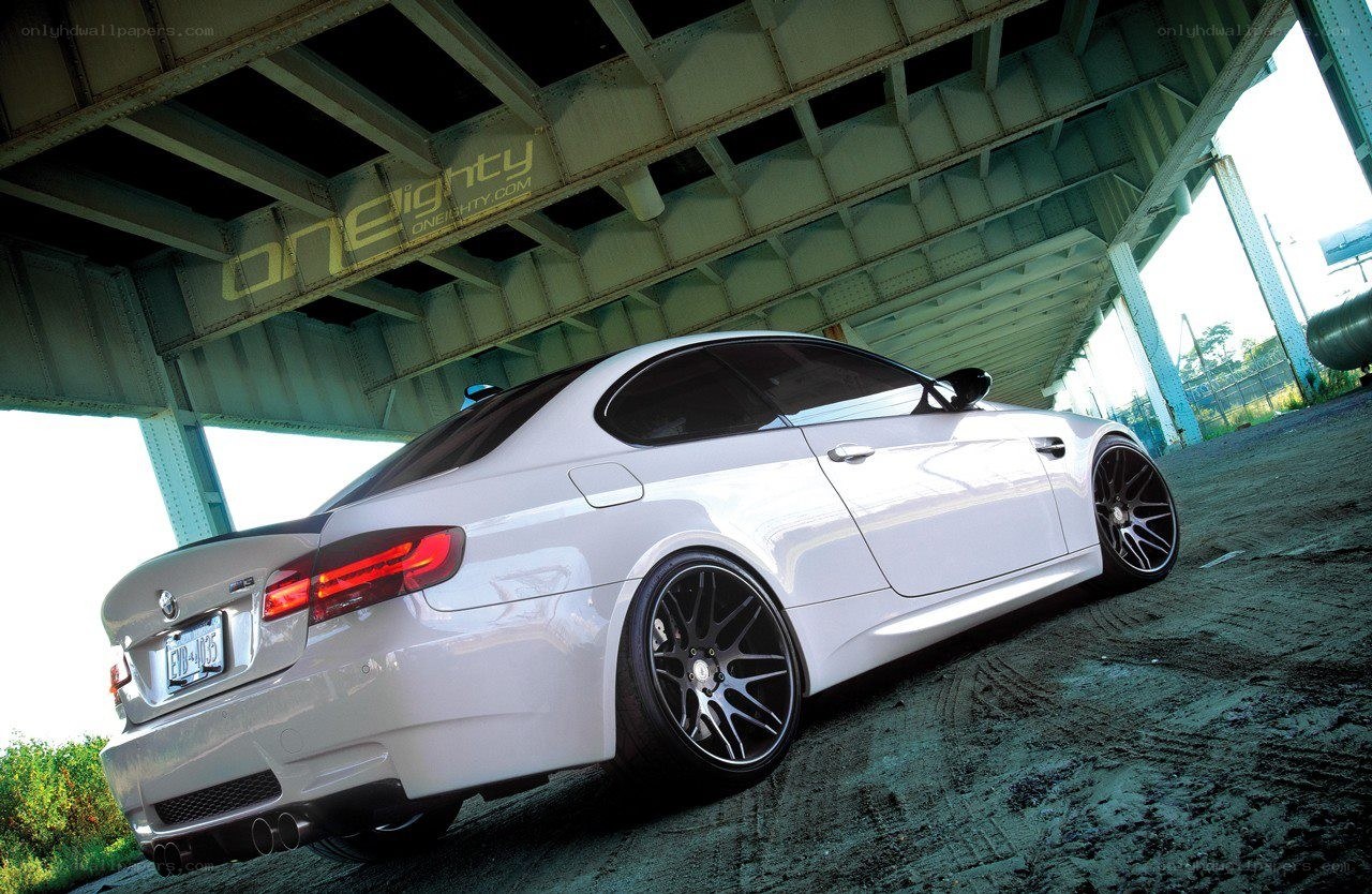 white bmw m3 under bridge