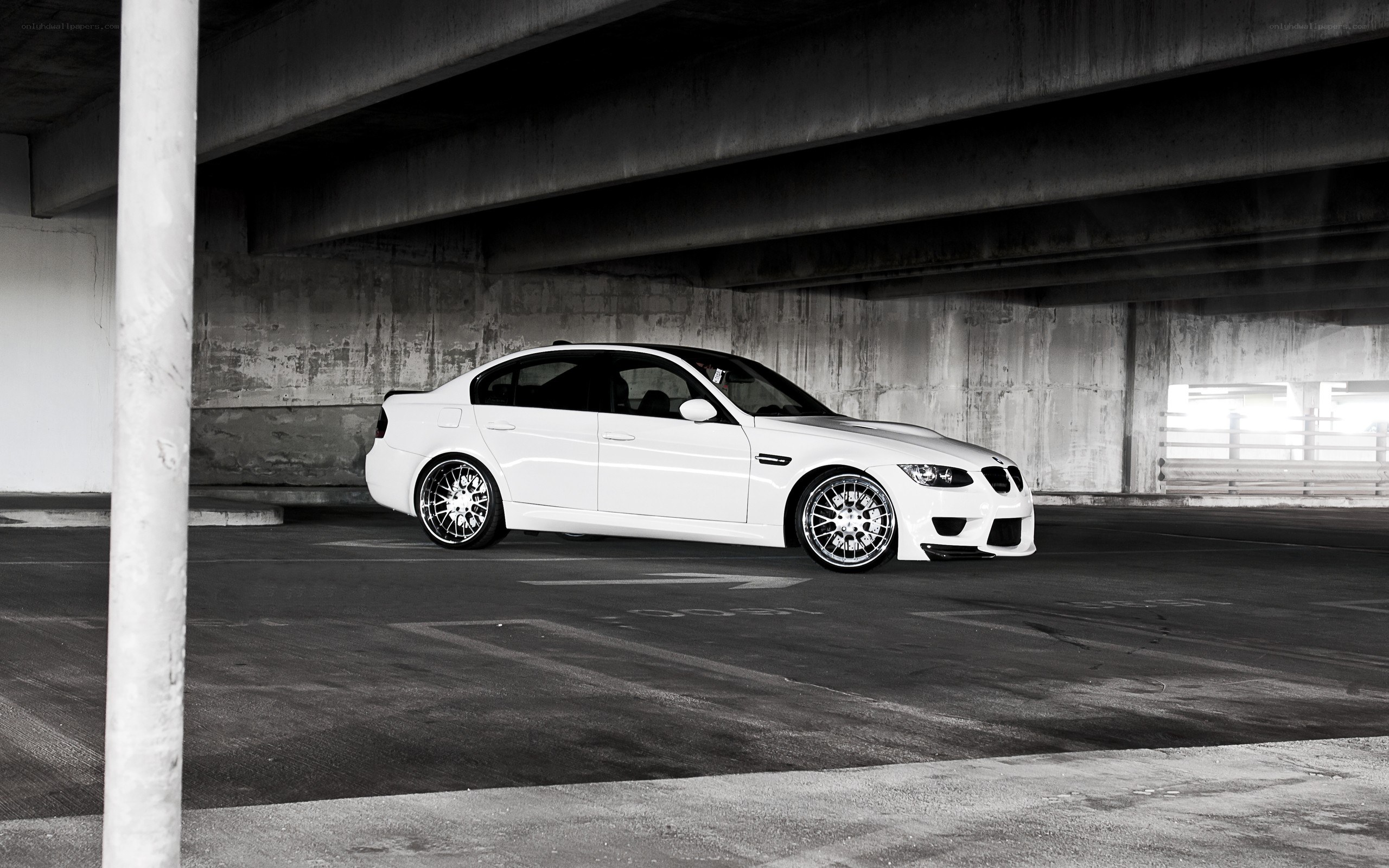 white bmw m3 under overpass