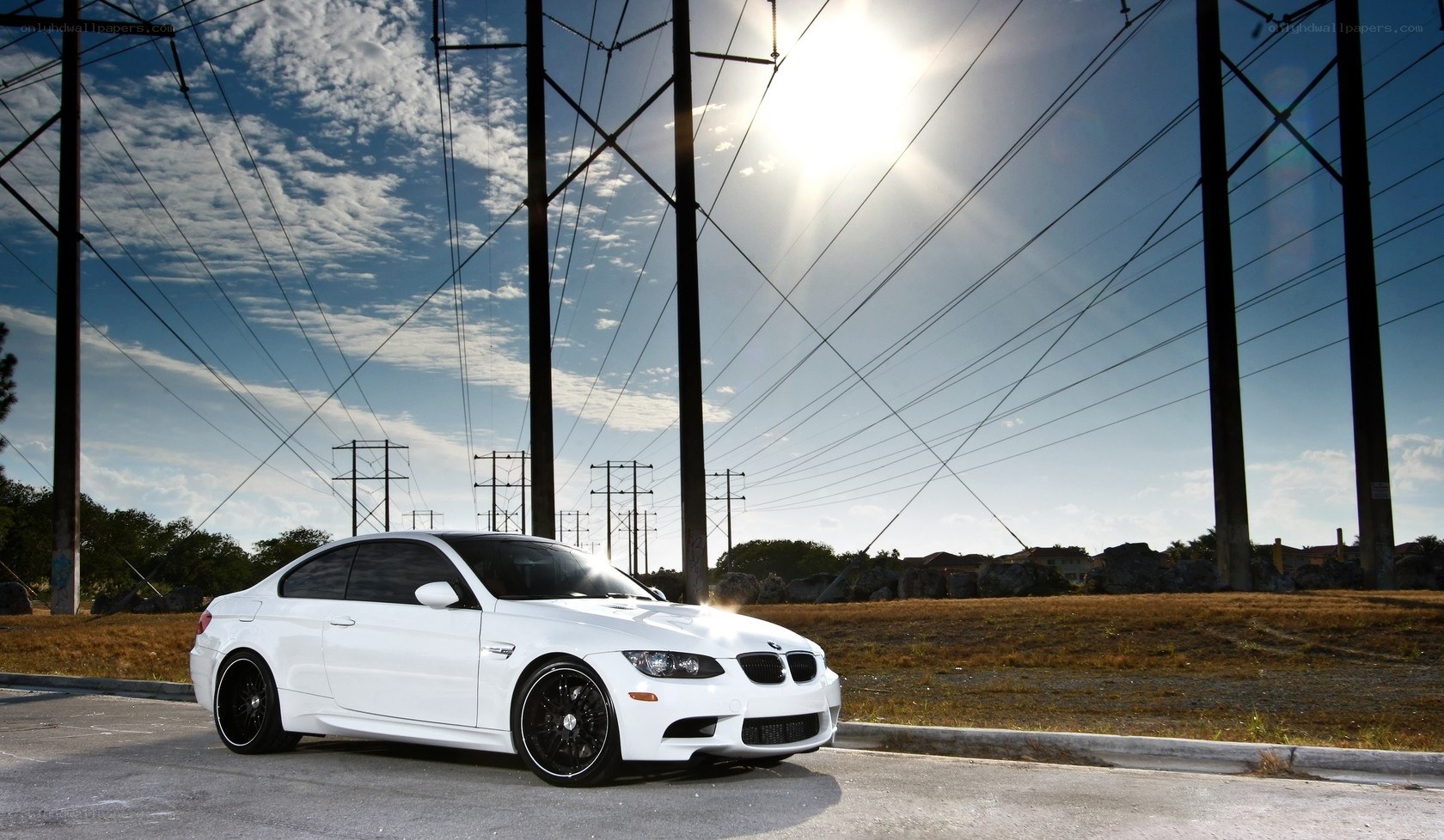 White BMW M3 under power lines
