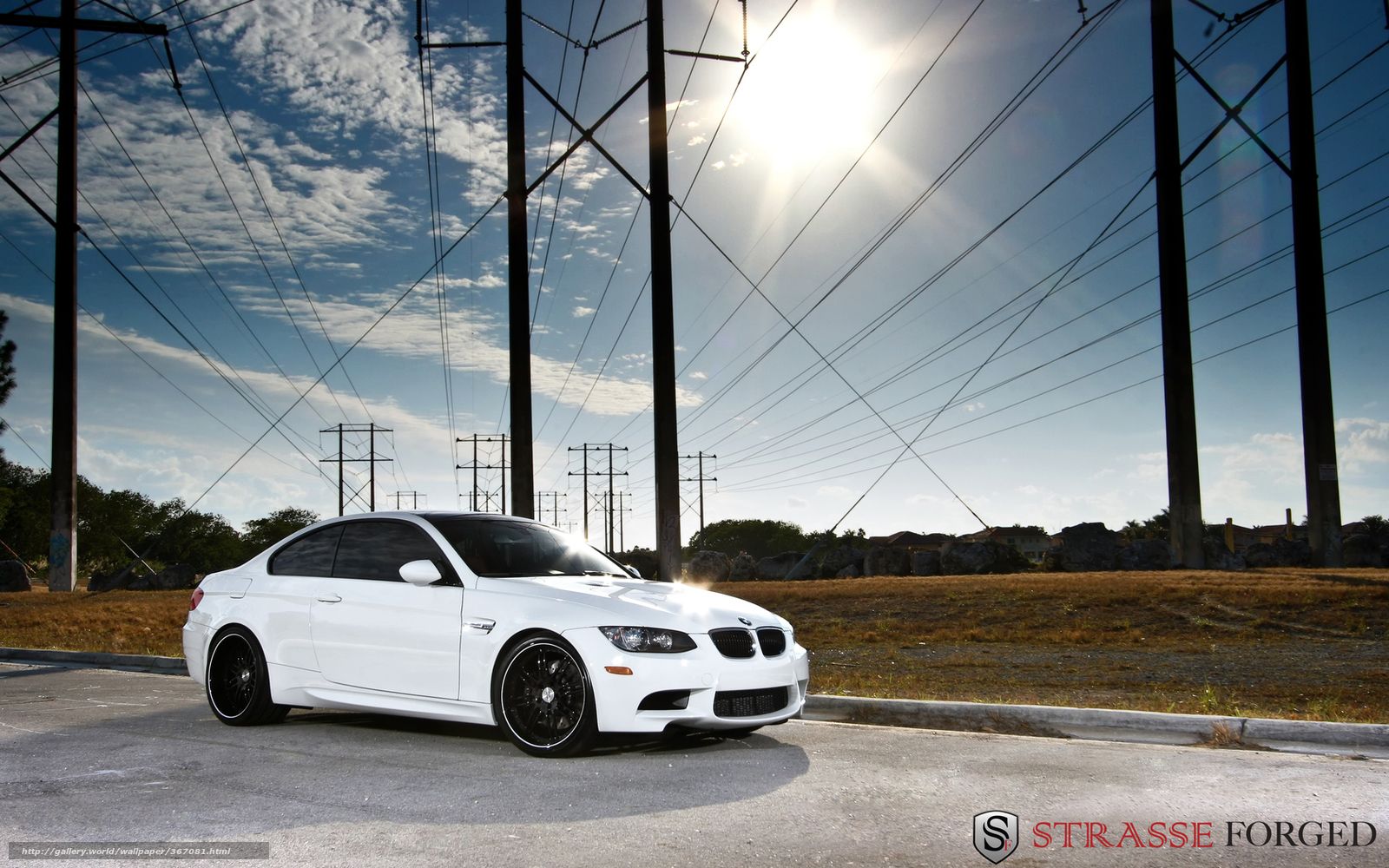white bmw m3 under power lines