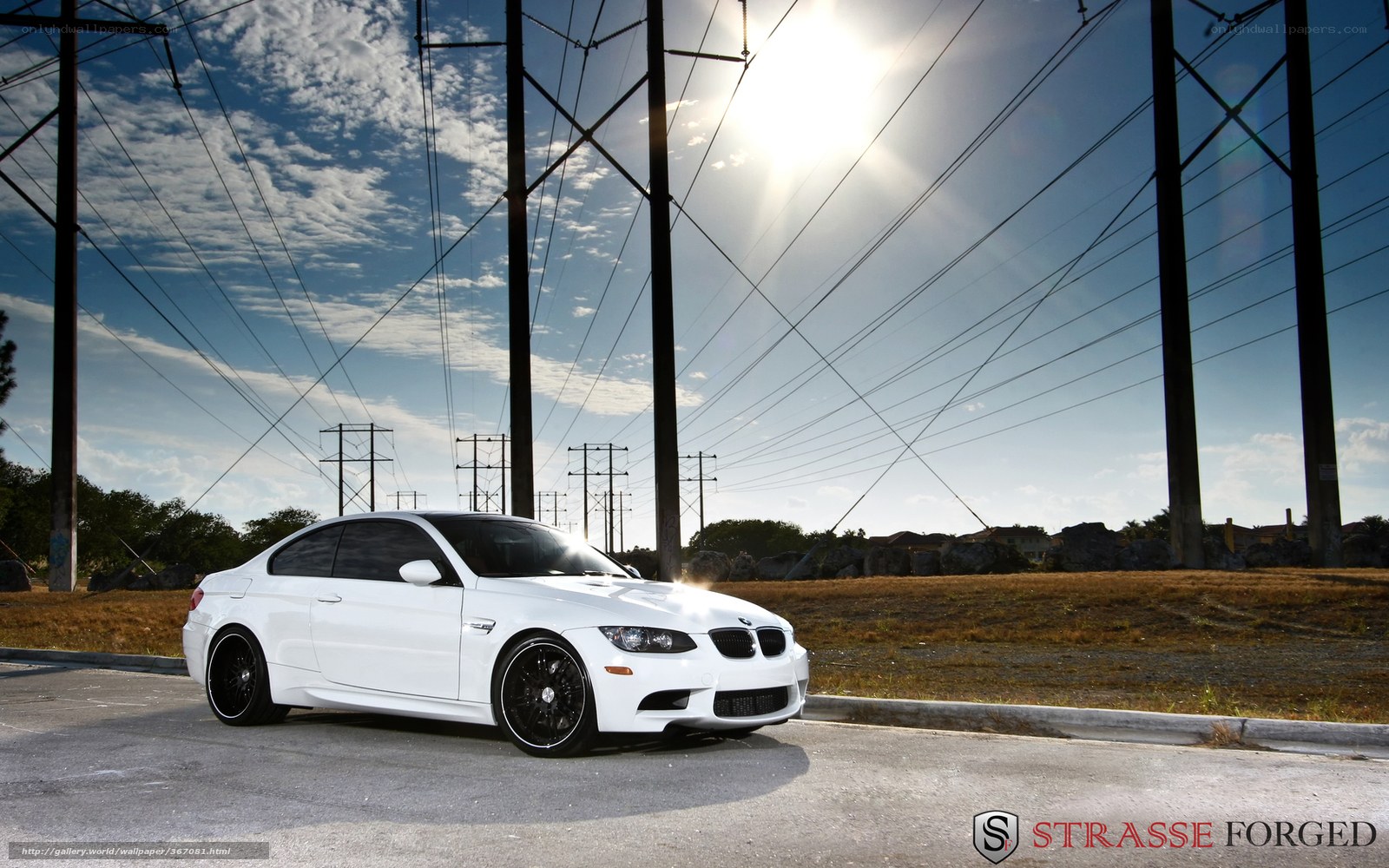 white bmw m3 under power lines