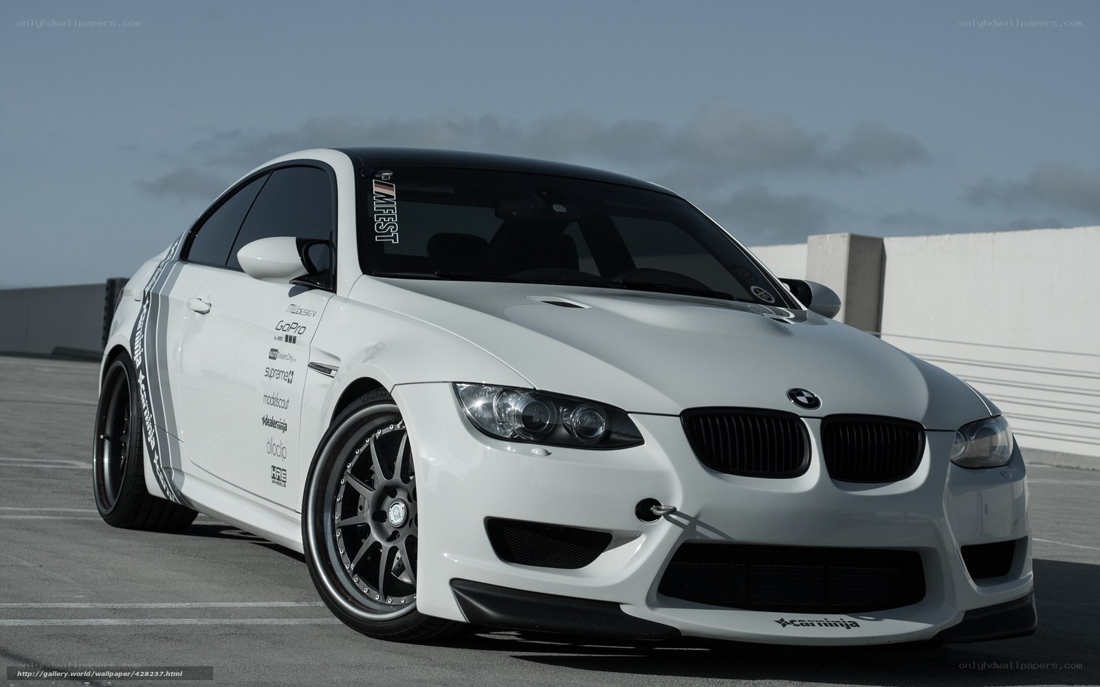 white bmw m3 with decals