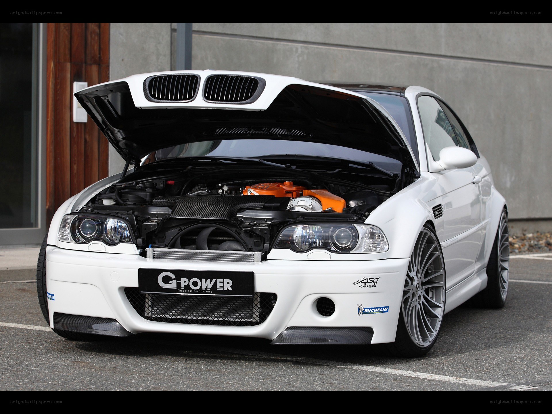 White BMW M3 with open hood
