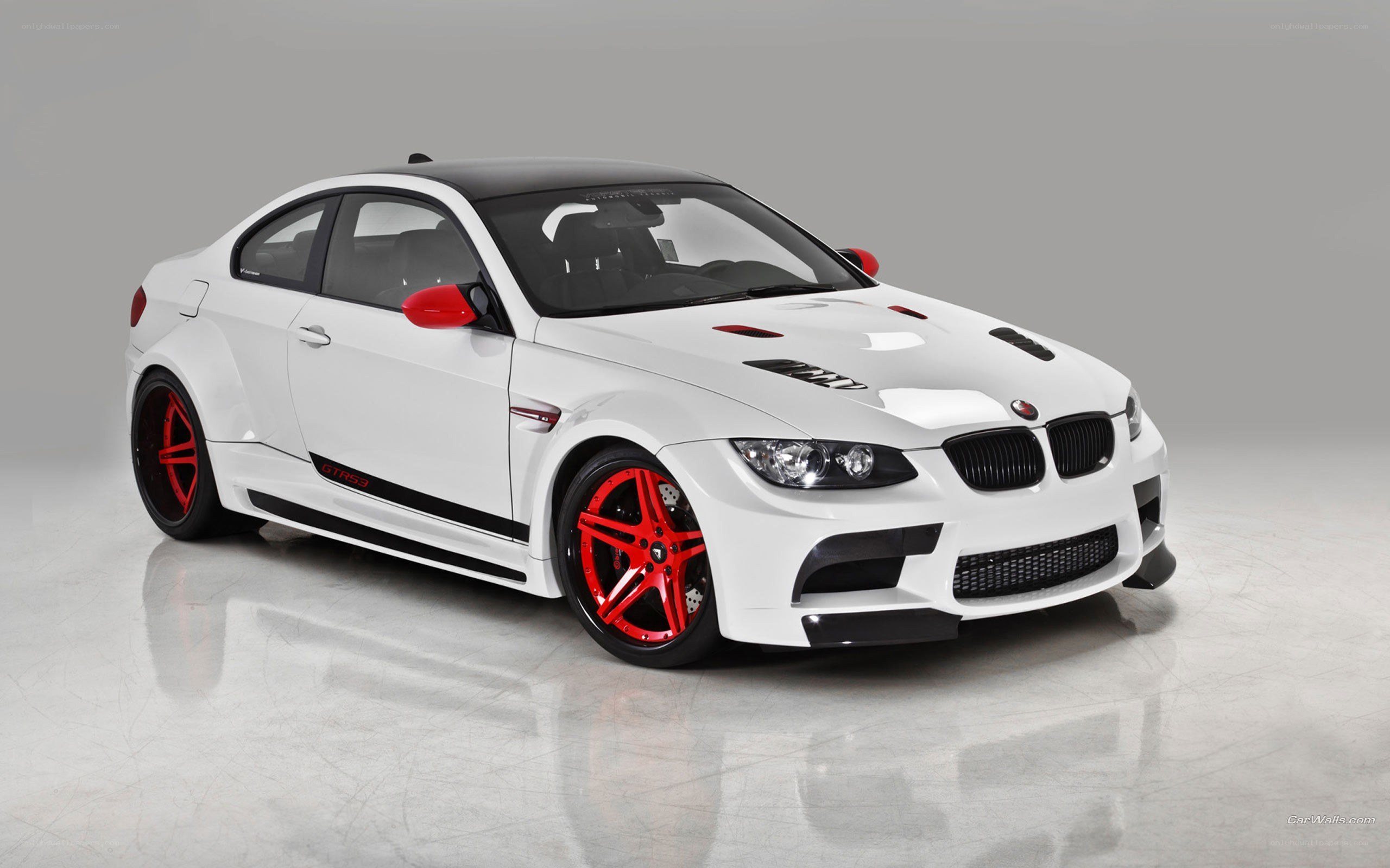 white bmw m3 with red wheels