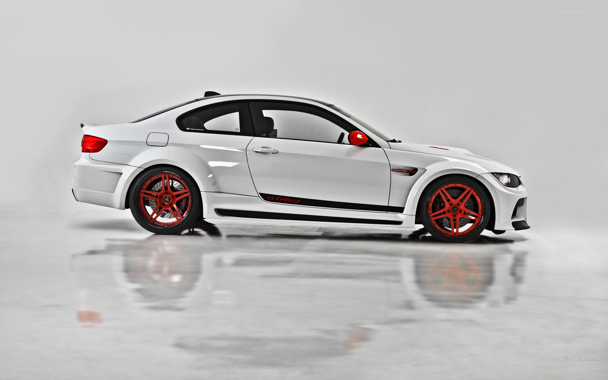 white bmw m3 with red wheels