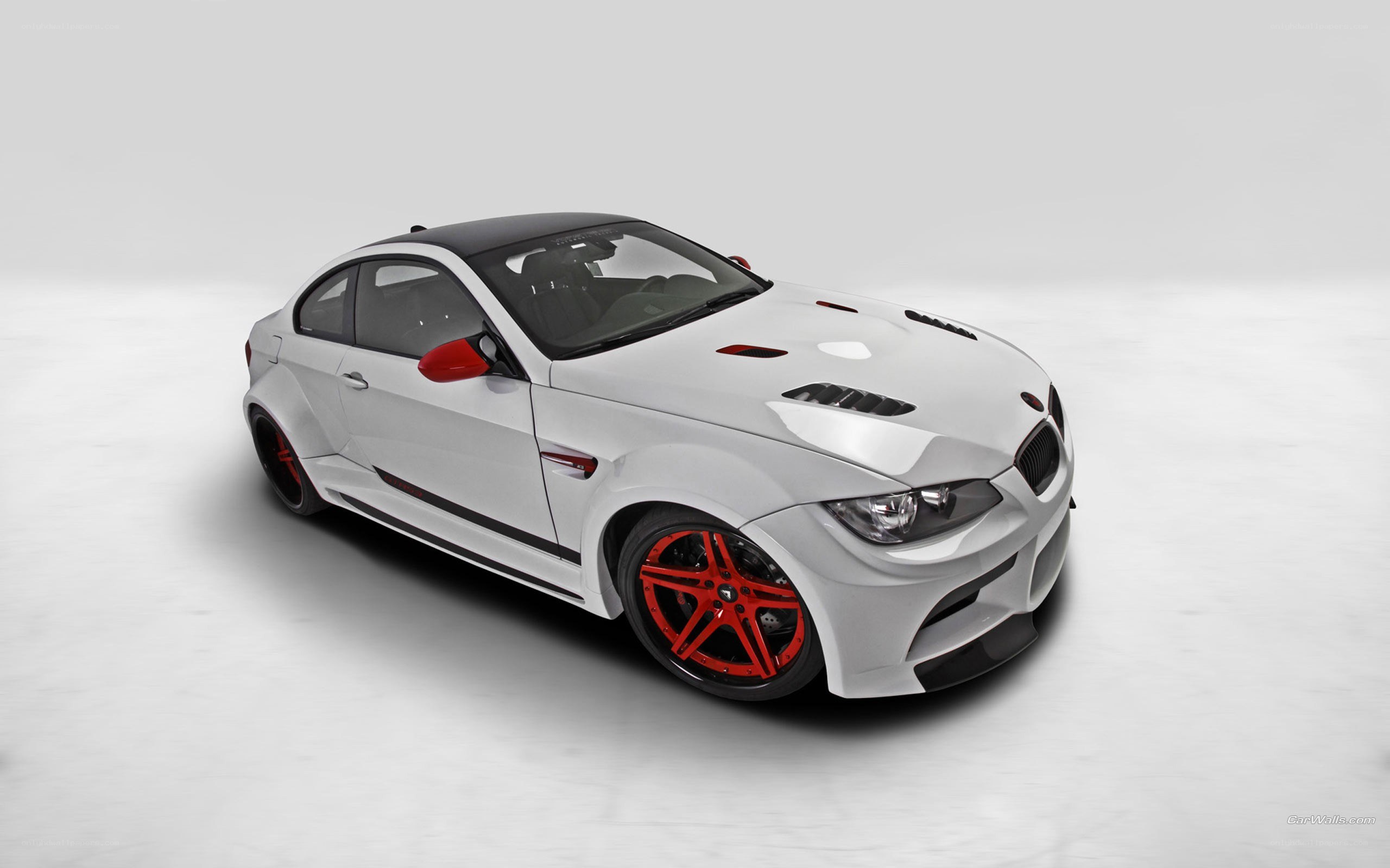 white bmw m3 with red wheels