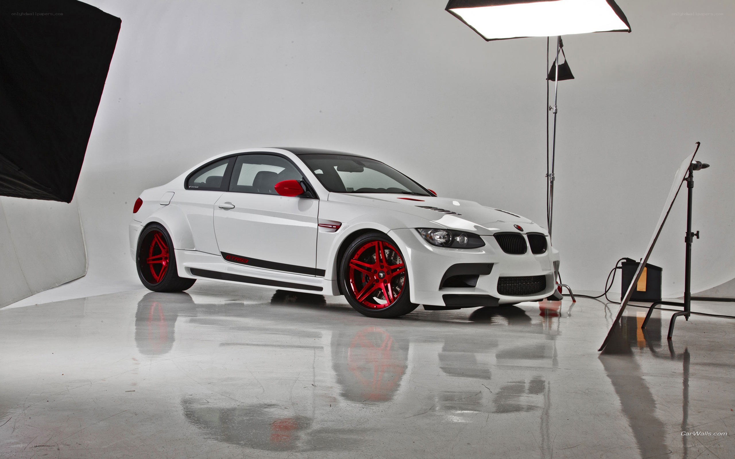 white bmw m3 with red wheels