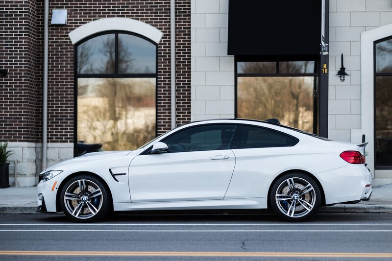 White BMW M4 parked on street