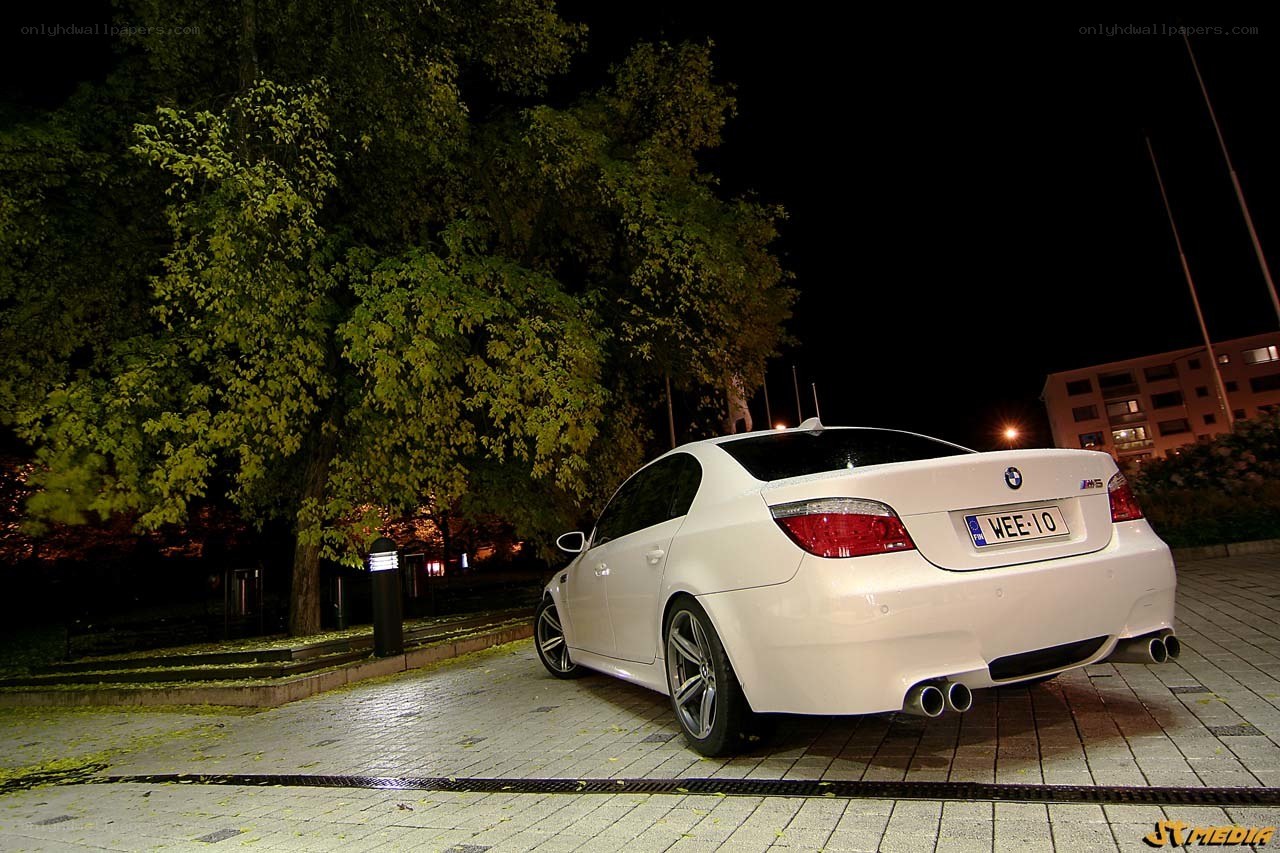 White BMW M5 at night