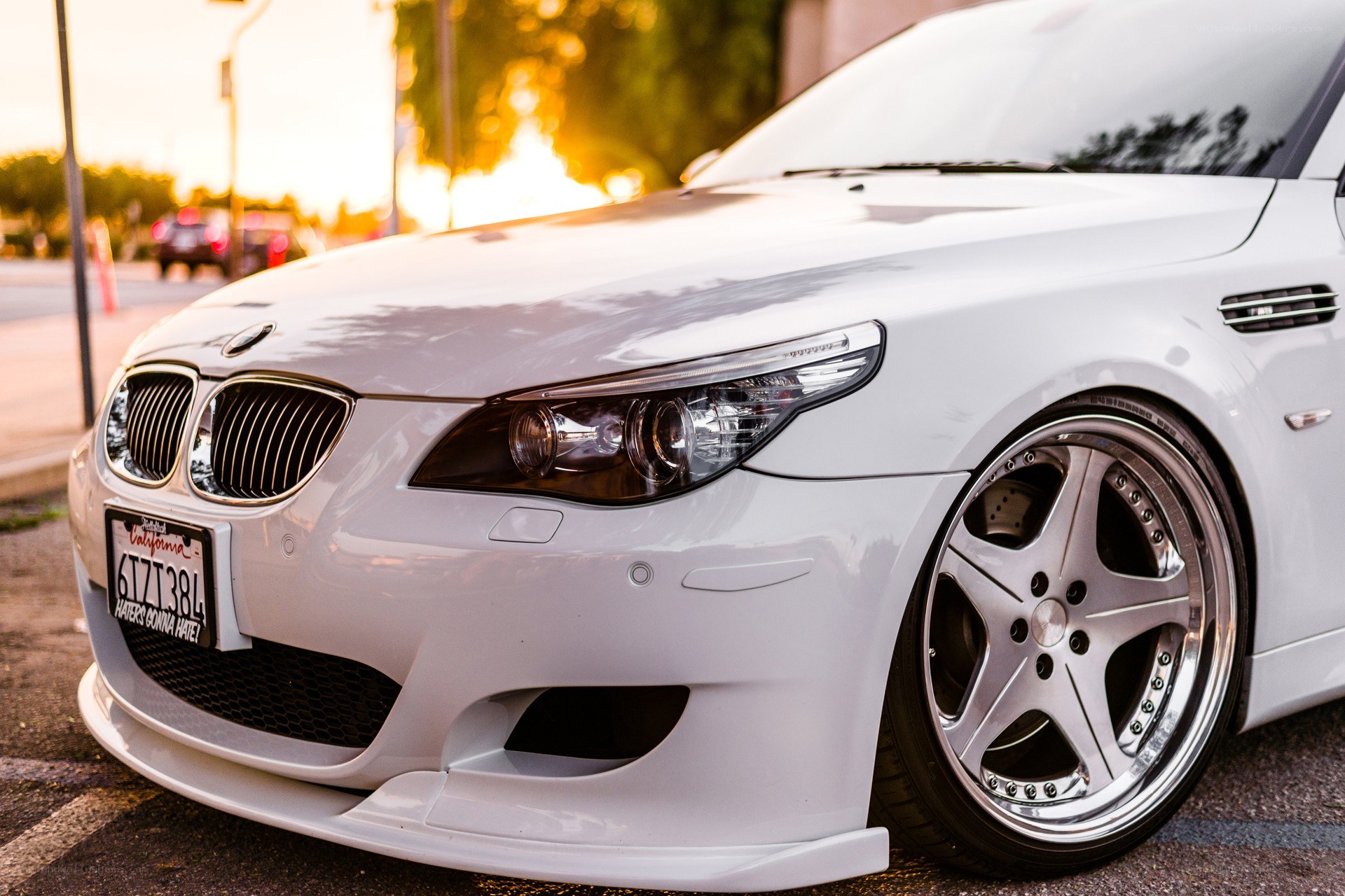 white bmw m5 at sunset