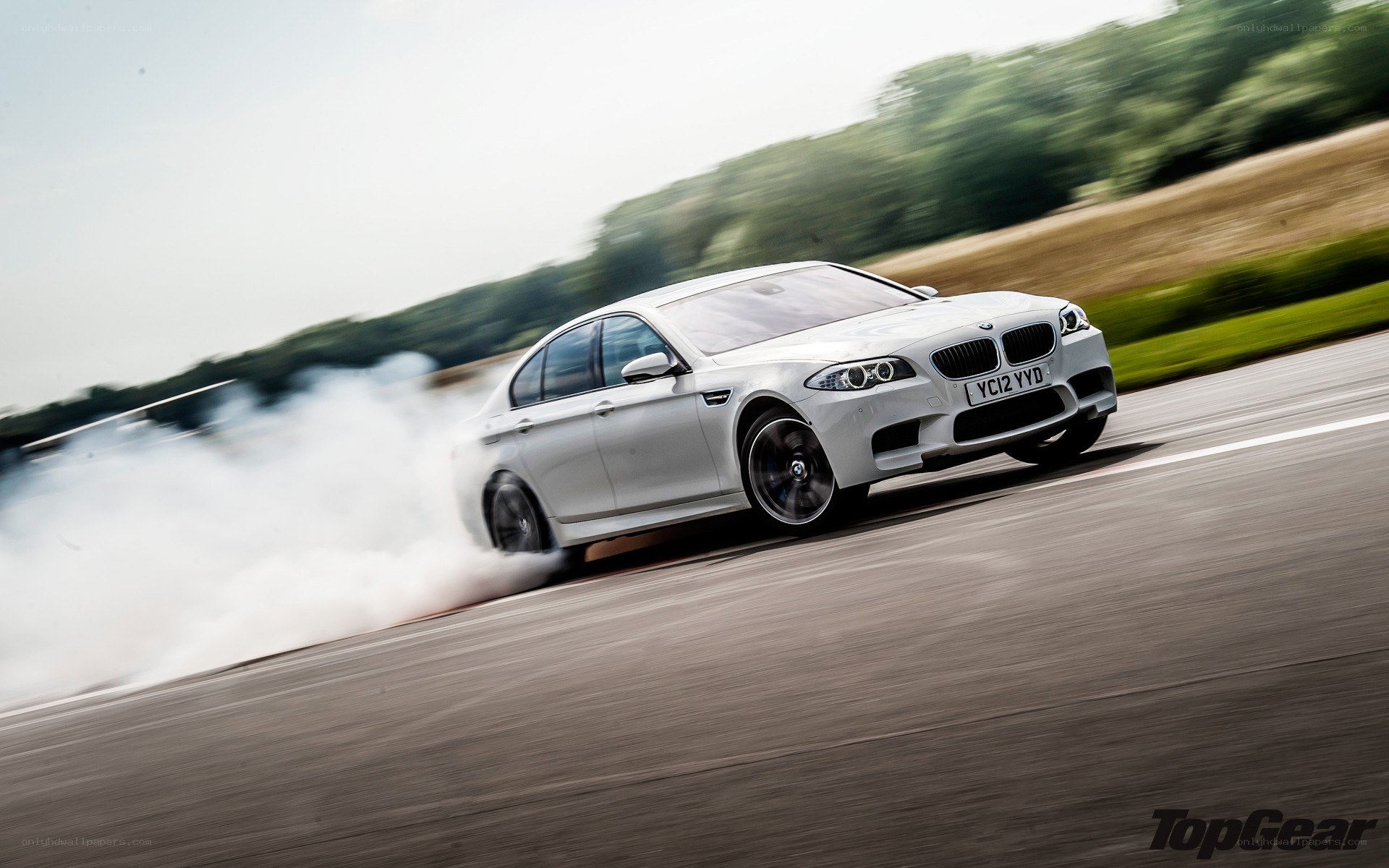 white bmw m5 drifting