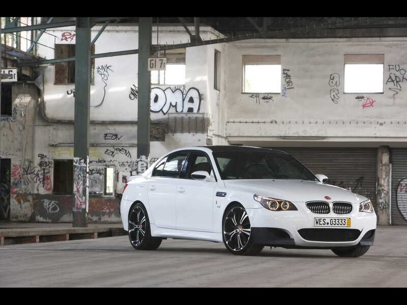 White BMW M5 in an industrial setting