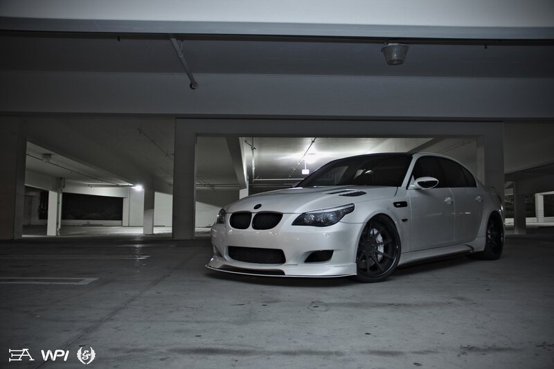 white bmw m5 in parking garage