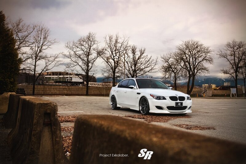 White BMW M5 in parking lot