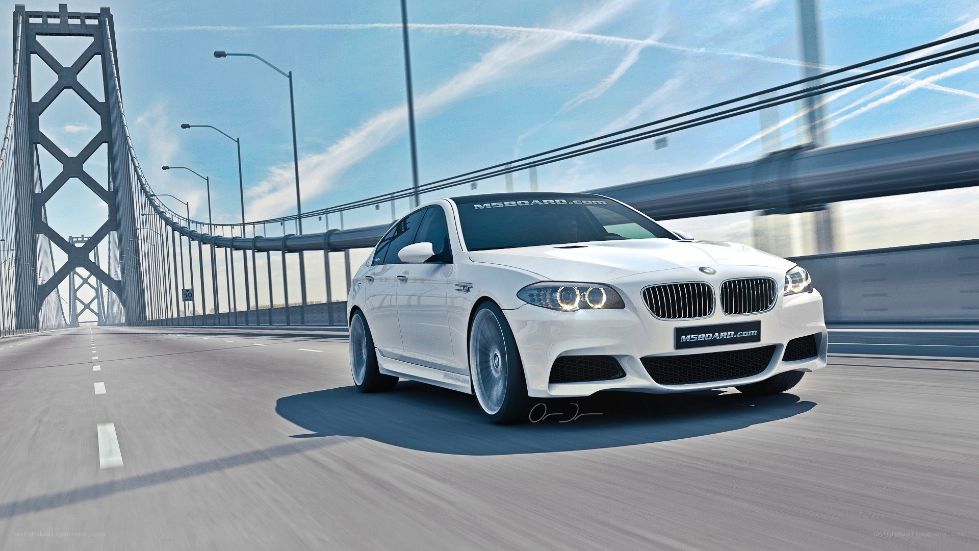 white bmw m5 on a bridge