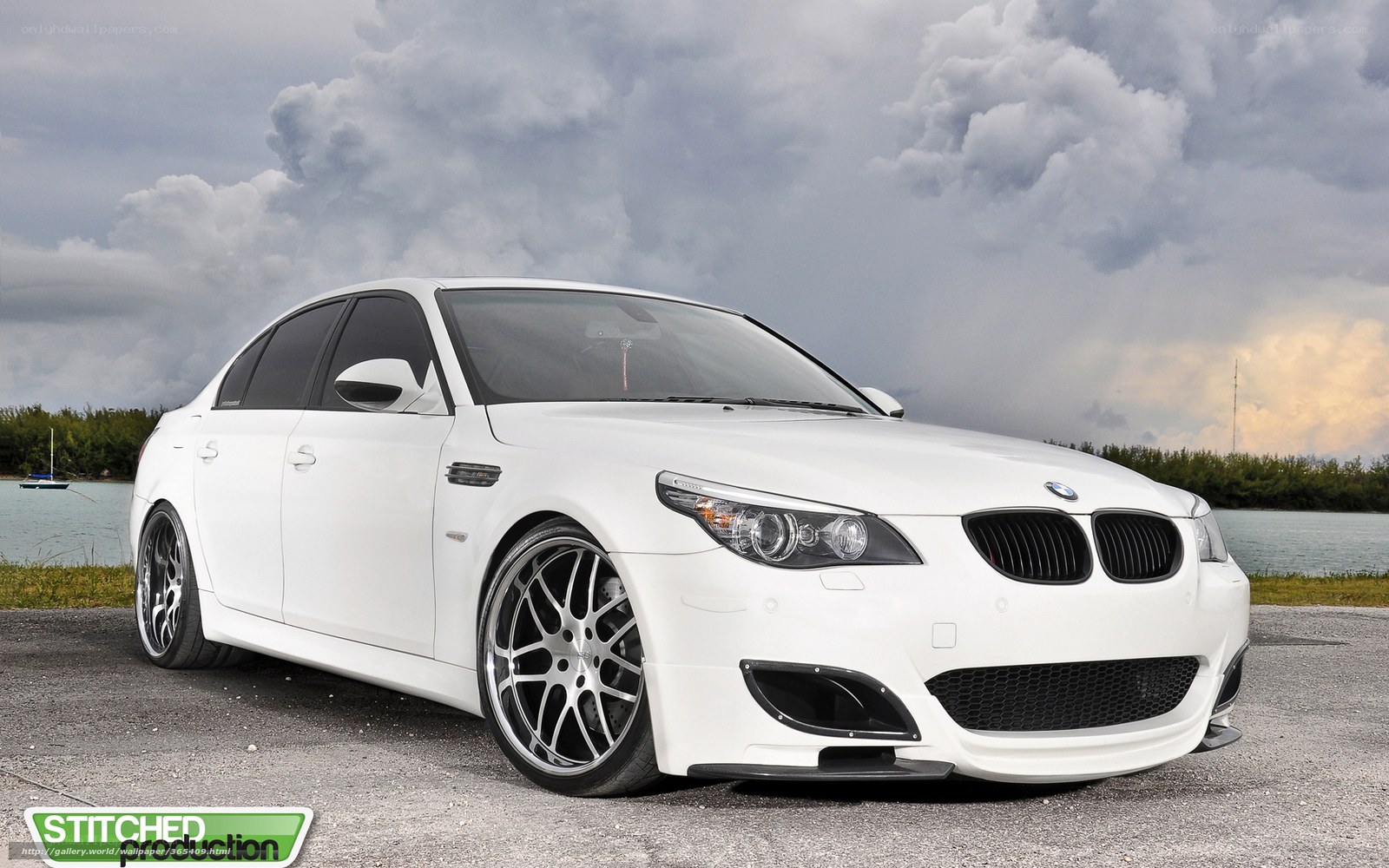 White BMW M5 on a cloudy day