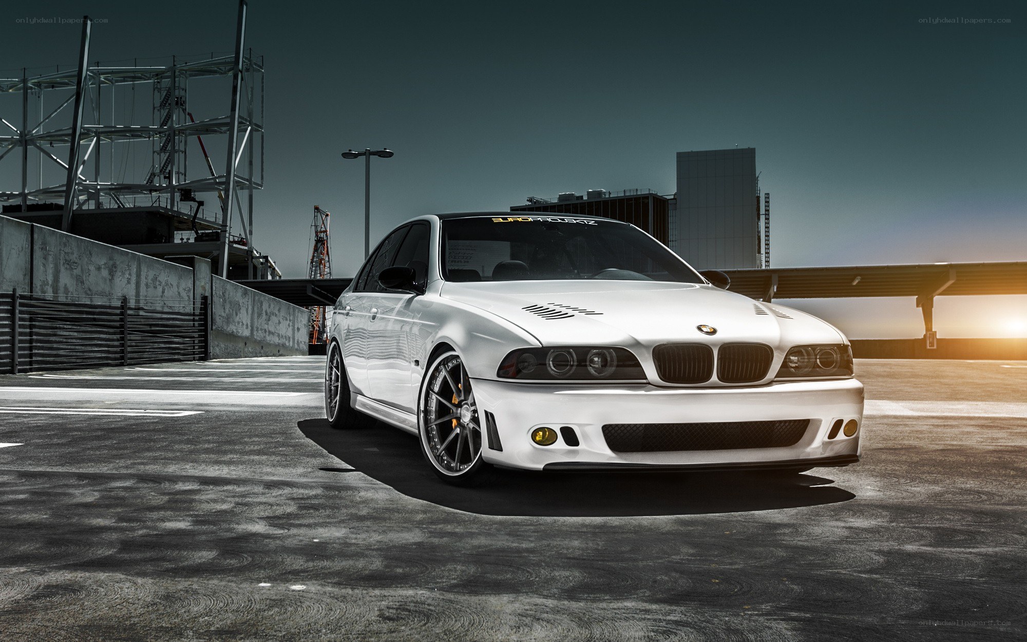 white bmw m5 on a rooftop