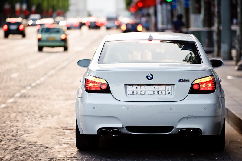 white bmw m5 on city street