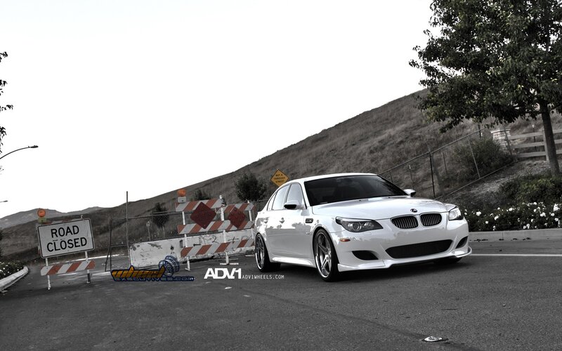 White BMW M5 on closed road