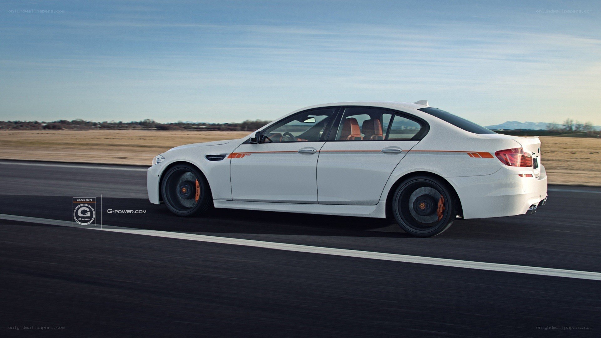 white bmw m5 on track