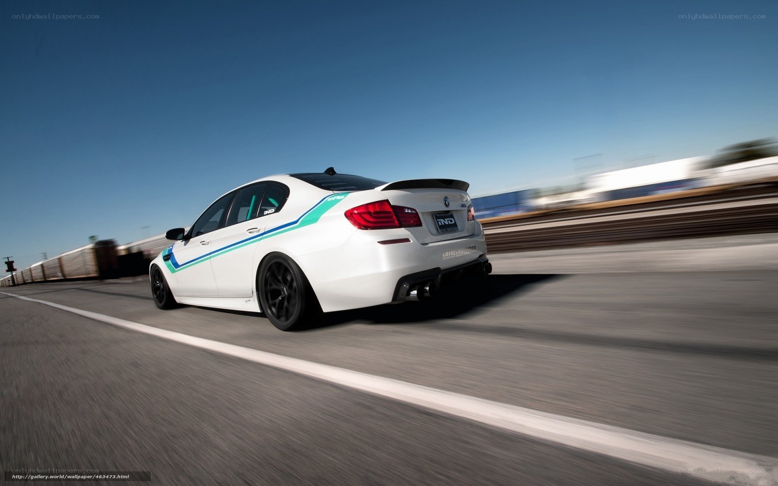 white bmw m5 on track