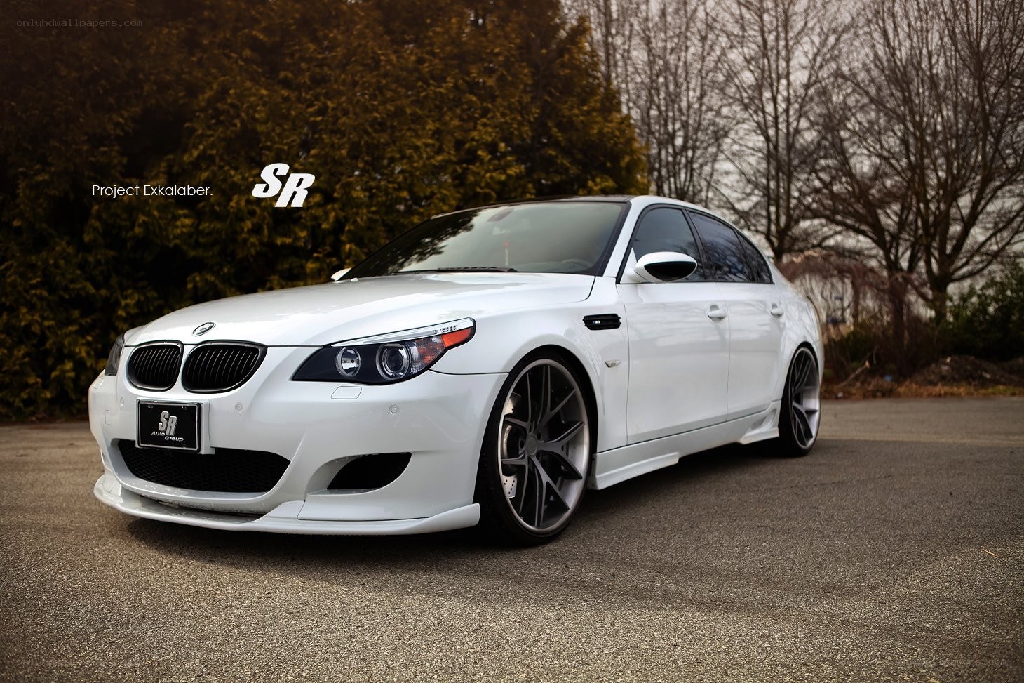 white bmw m5 sedan