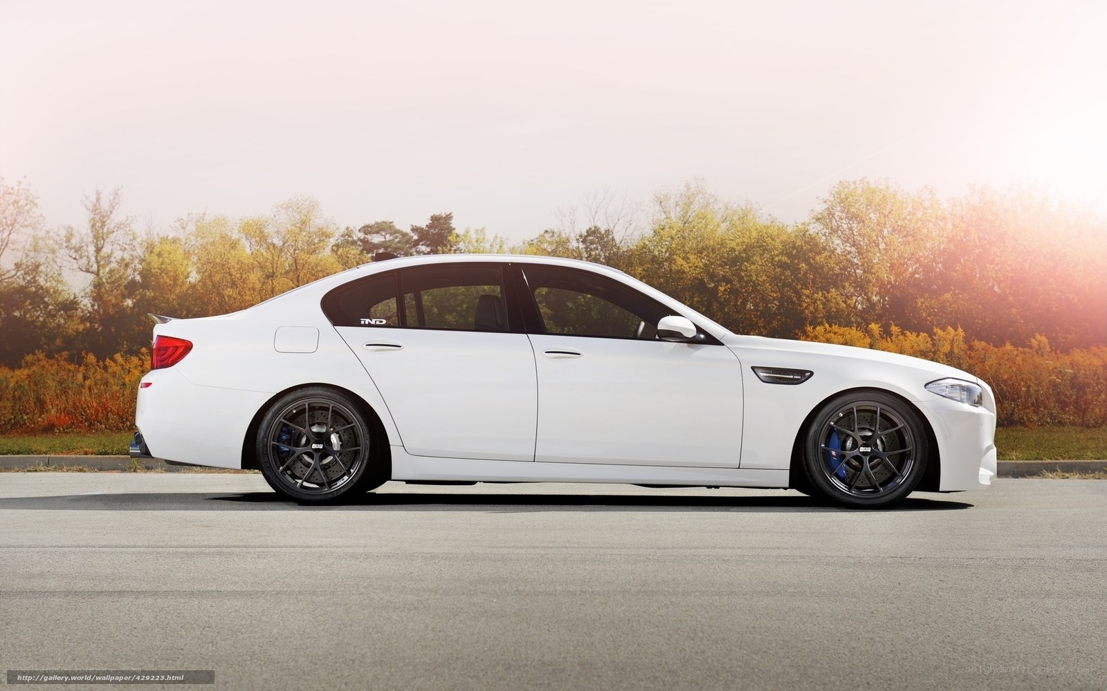 white bmw m5 sedan