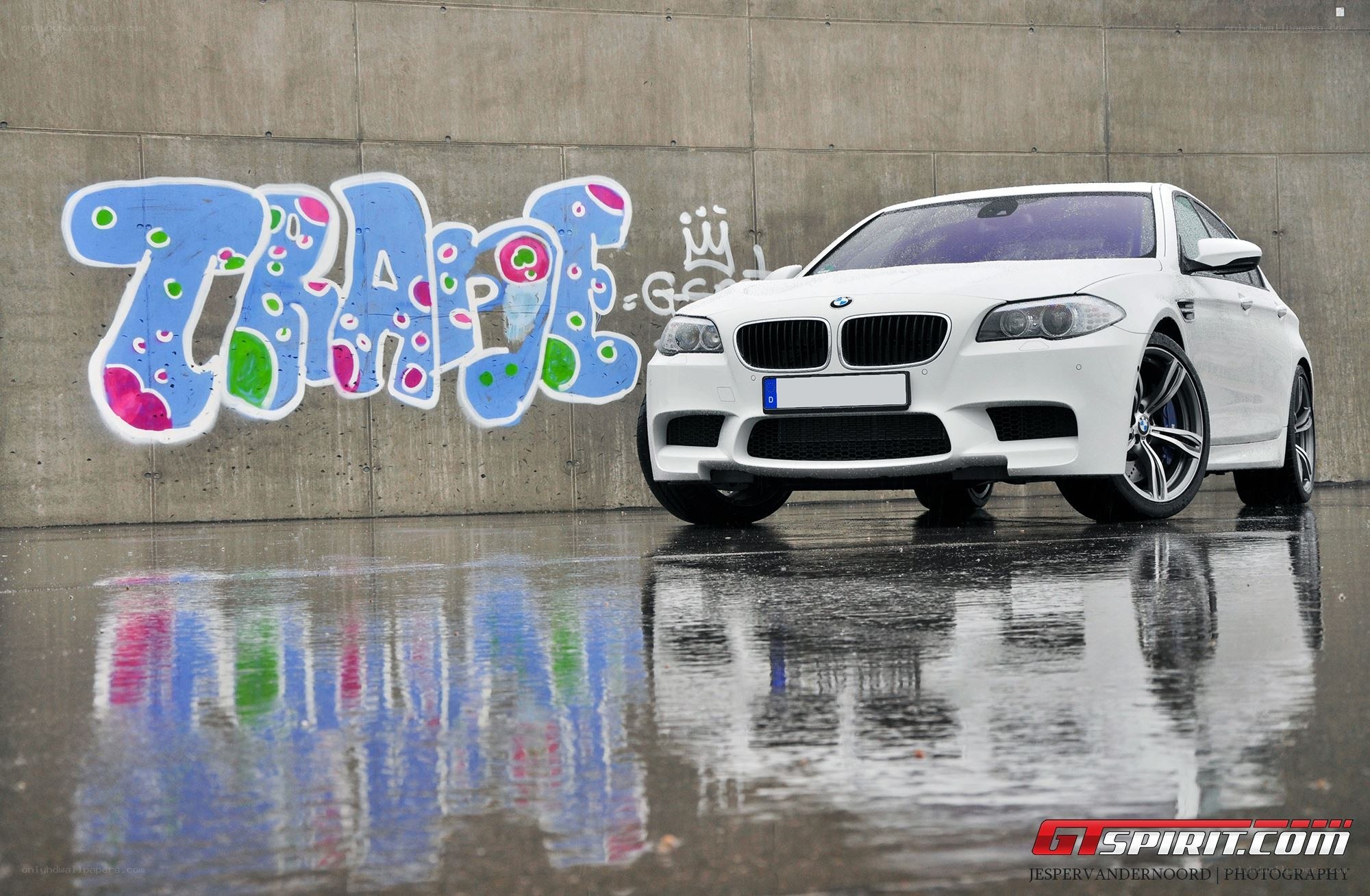 White BMW M5 with graffiti art