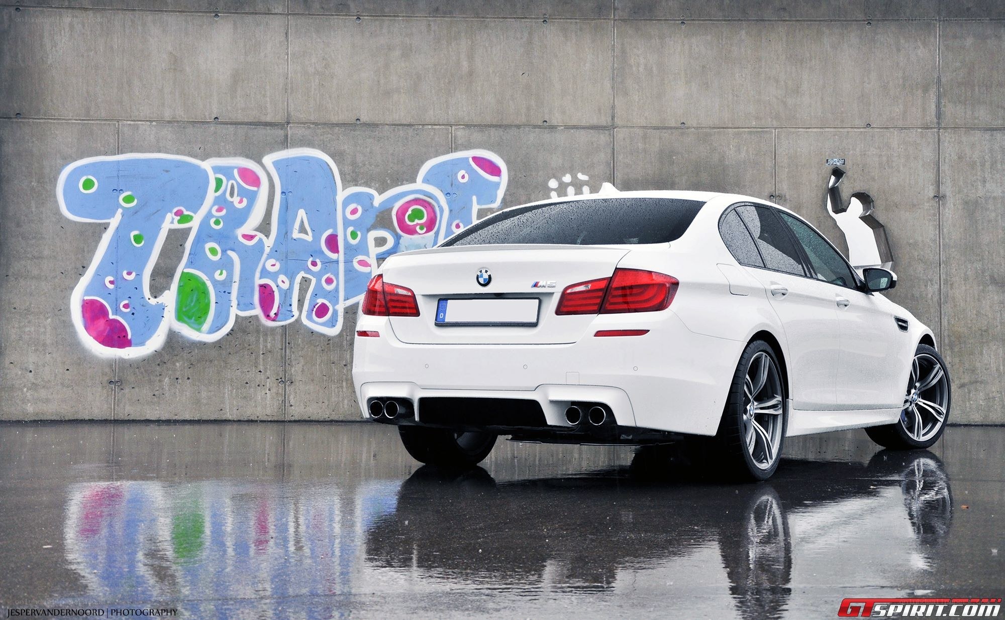 white bmw m5 with graffiti
