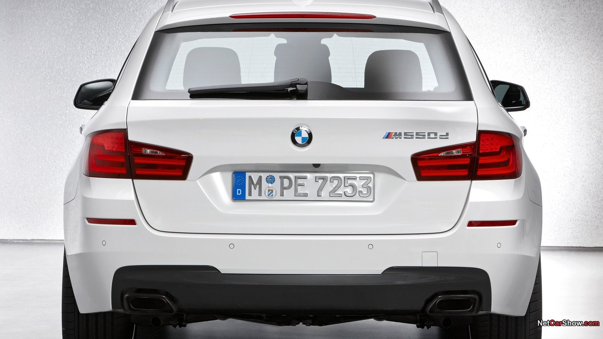 white bmw m550d rear view