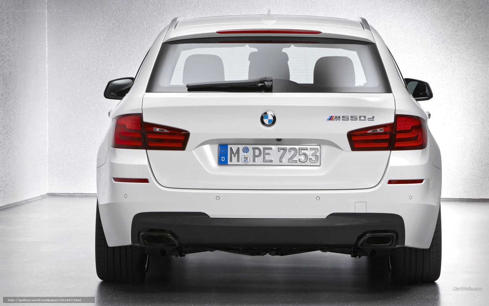 white bmw m550d rear view