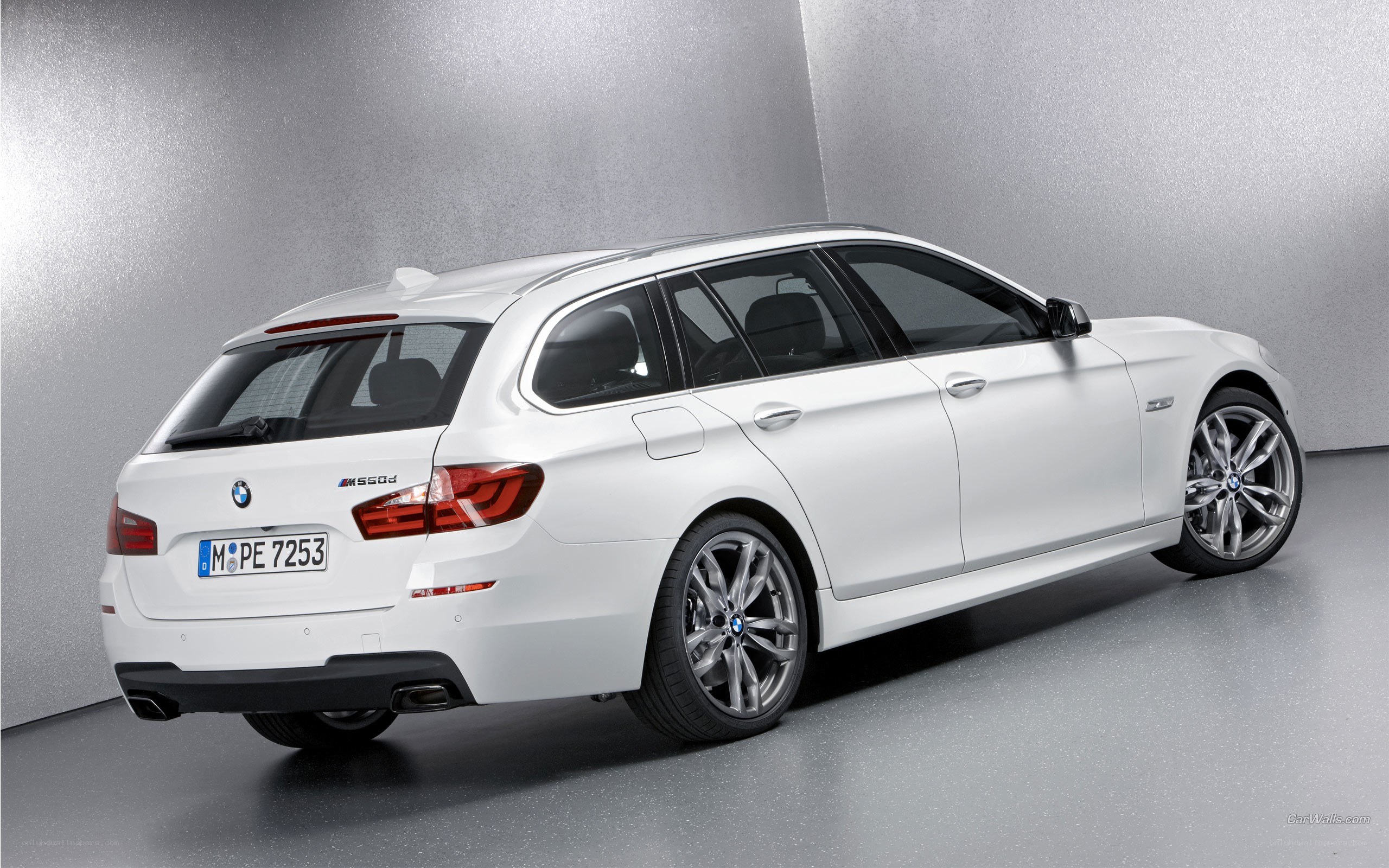 white bmw m550d station wagon