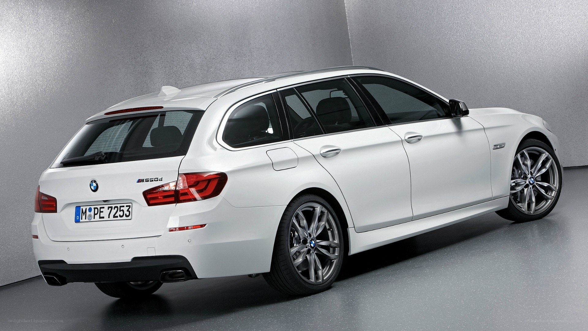 white bmw m550d station wagon