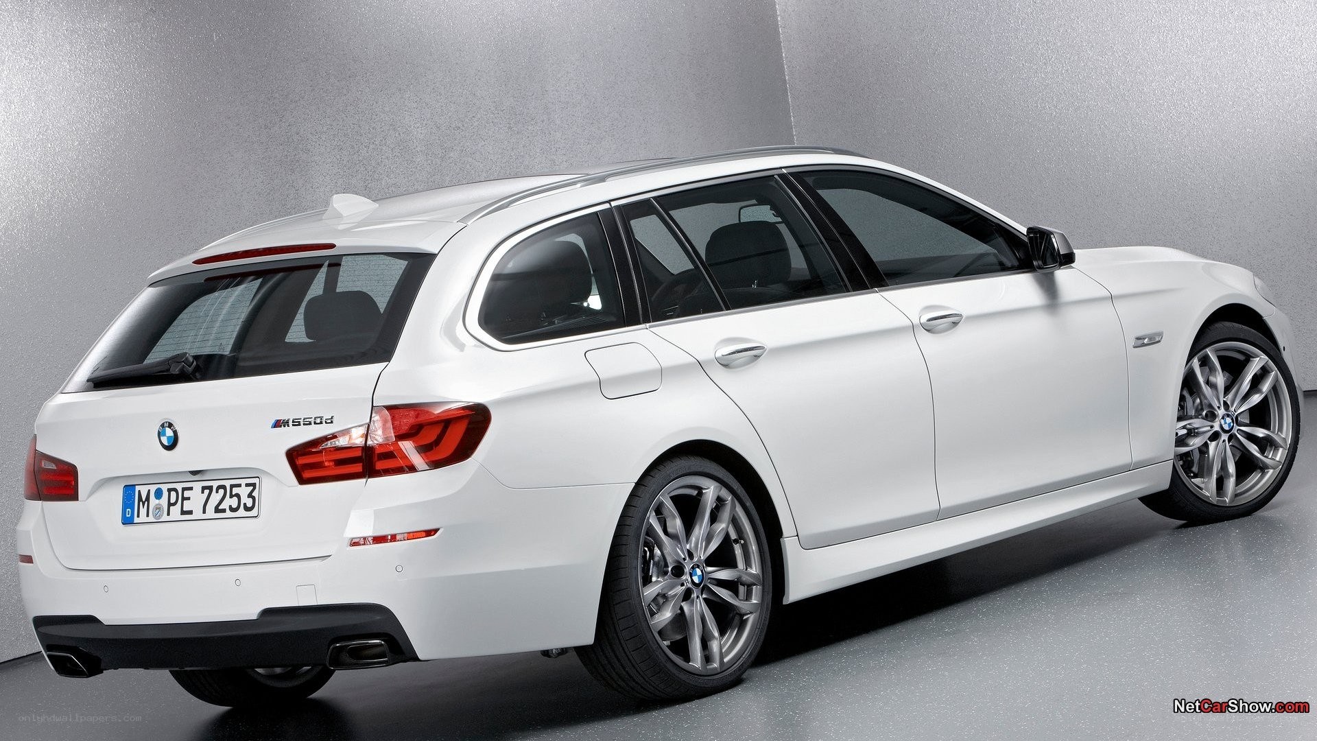 white bmw m550d station wagon
