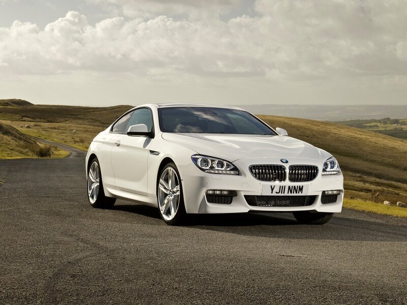 White BMW M6 on a country road