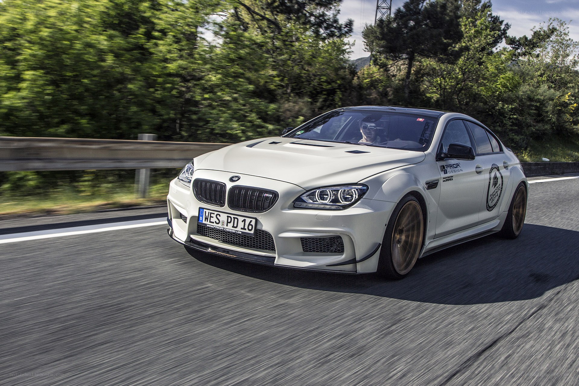white bmw m6 on a road