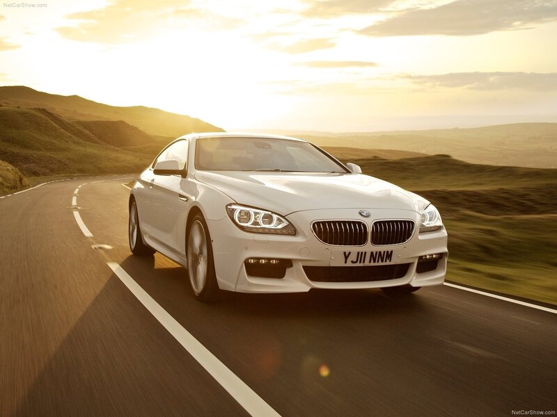 White BMW M6 on a winding road