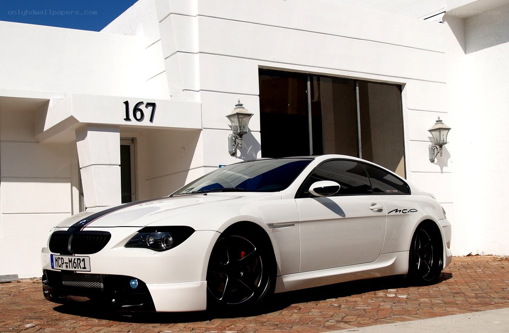 White BMW M6 parked outside