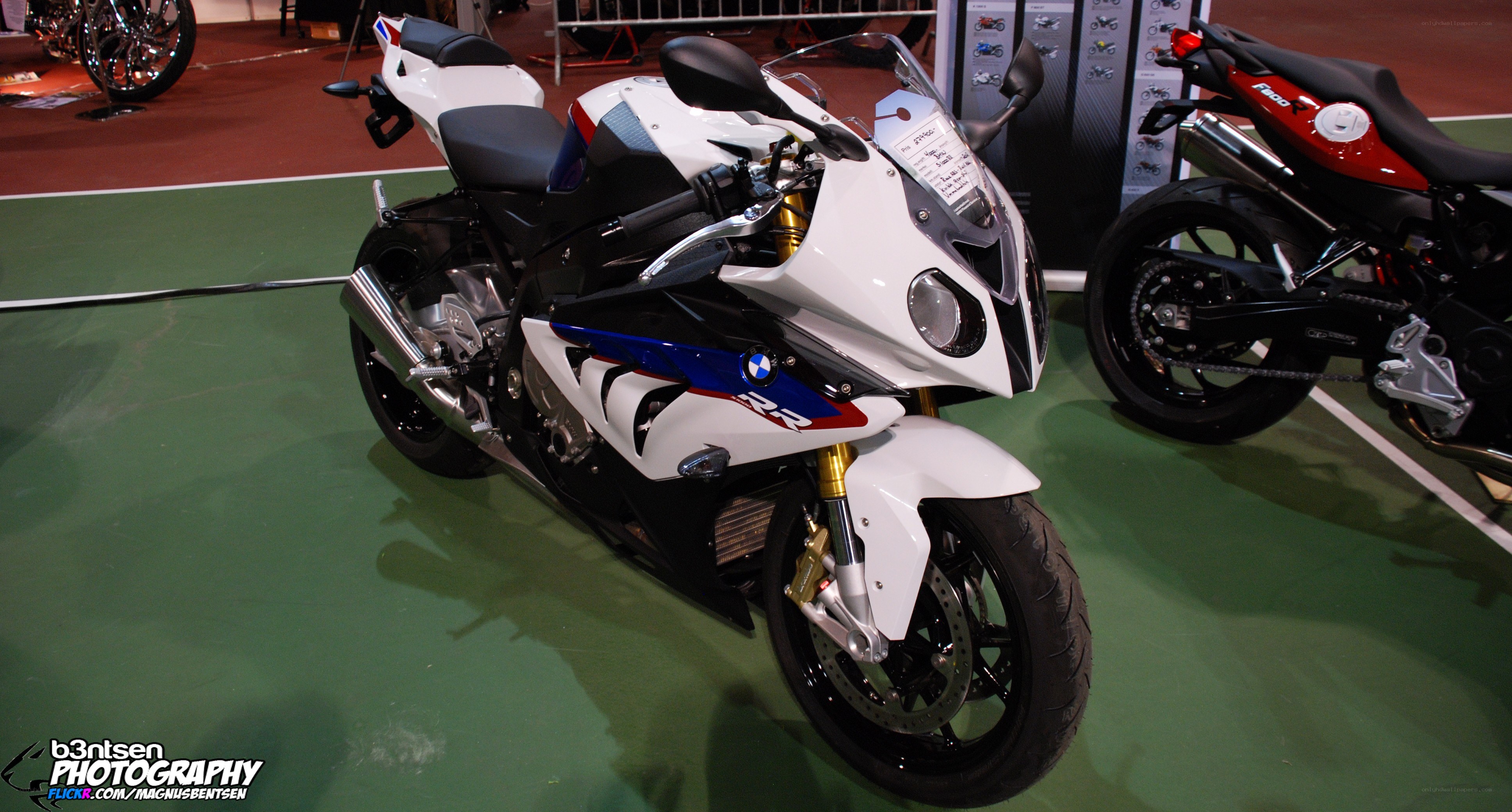 white bmw motorcycle on display