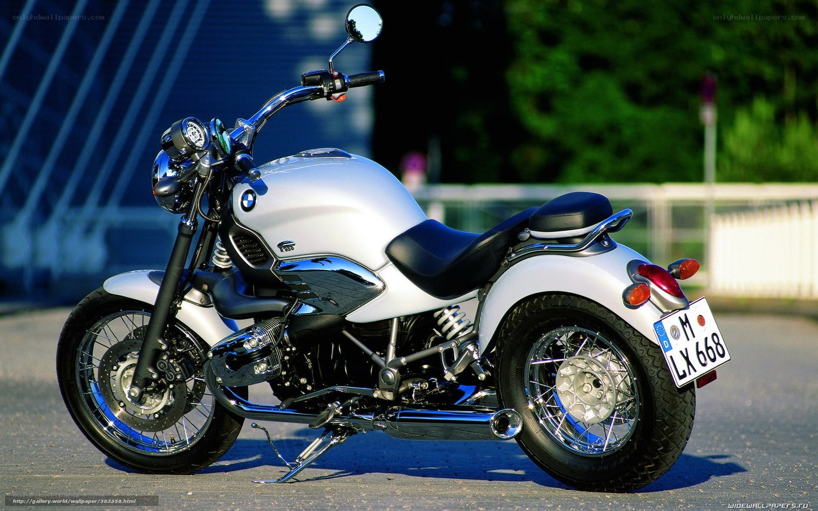 white BMW motorcycle on street