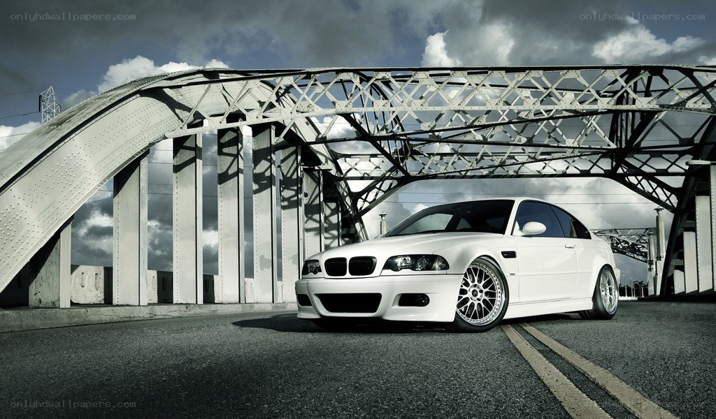 white bmw on a bridge