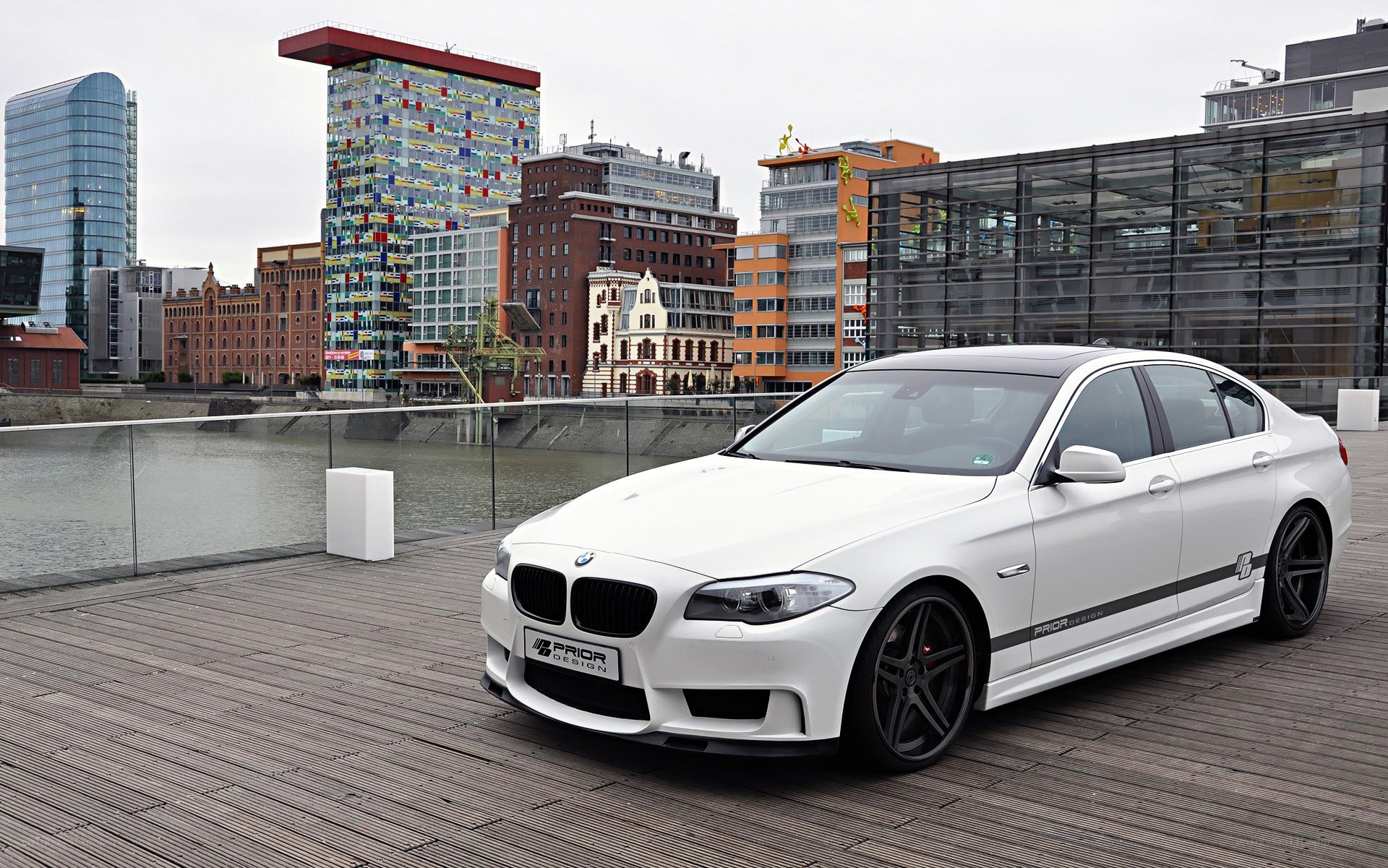 White BMW on a city dock