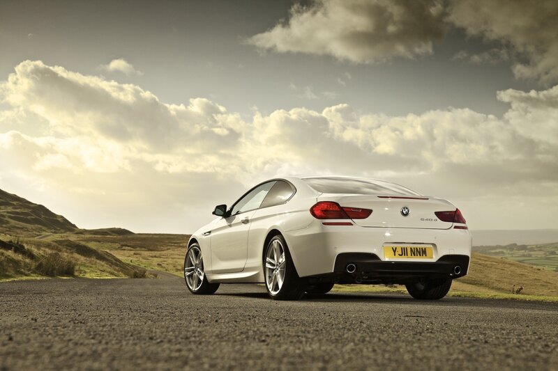 White BMW on a country road