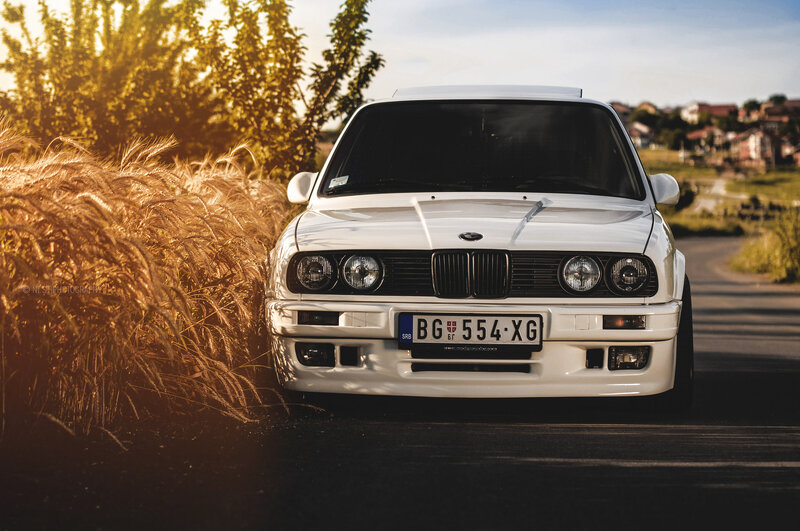 White BMW on a country road