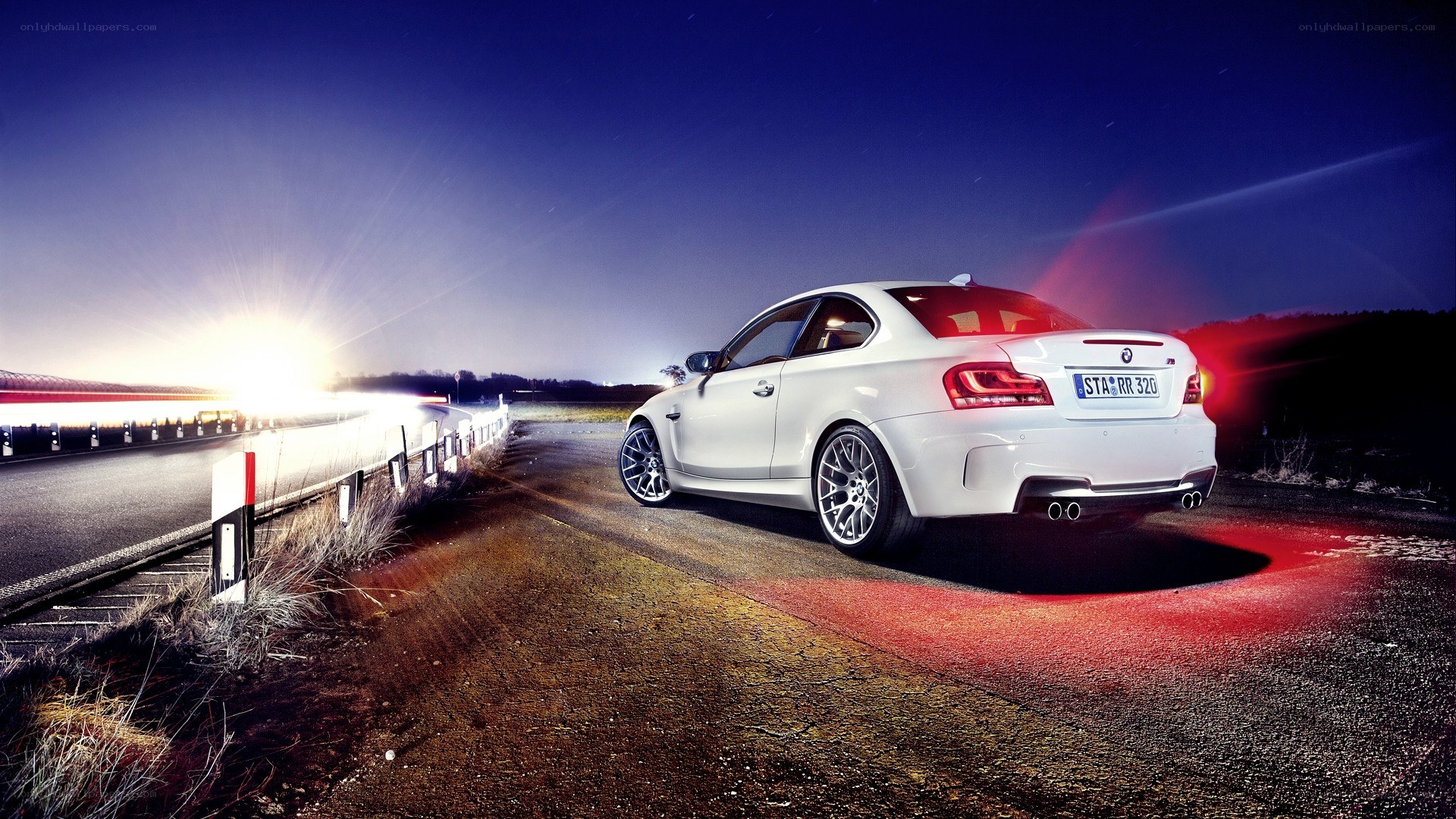 White BMW on a dark road