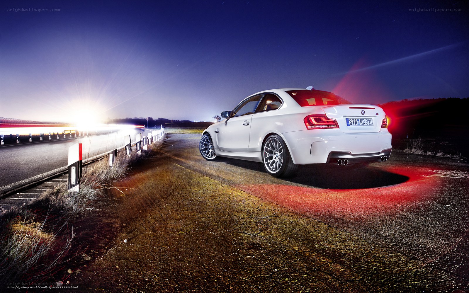 White BMW on a dark road