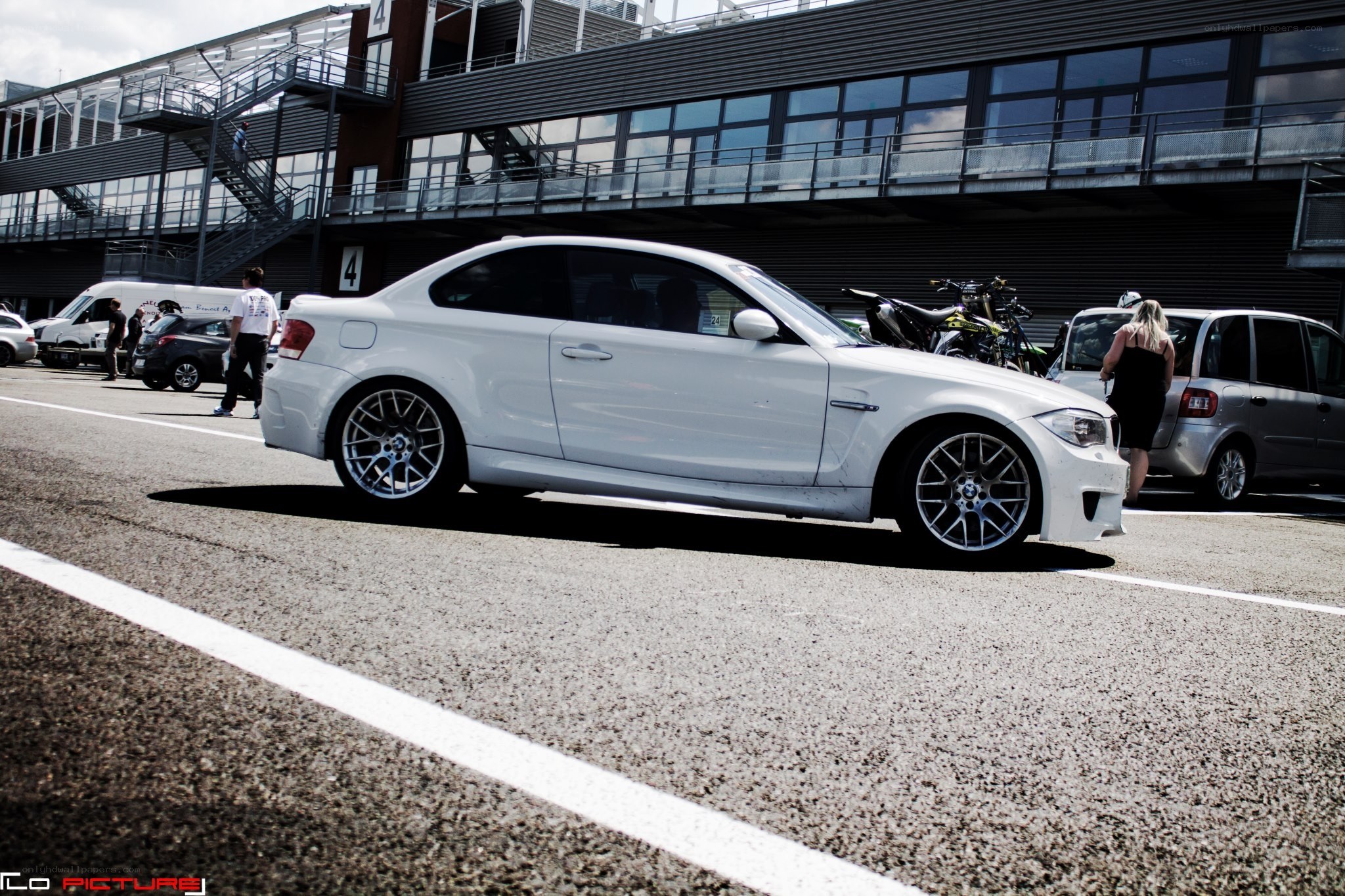 White BMW on a racetrack