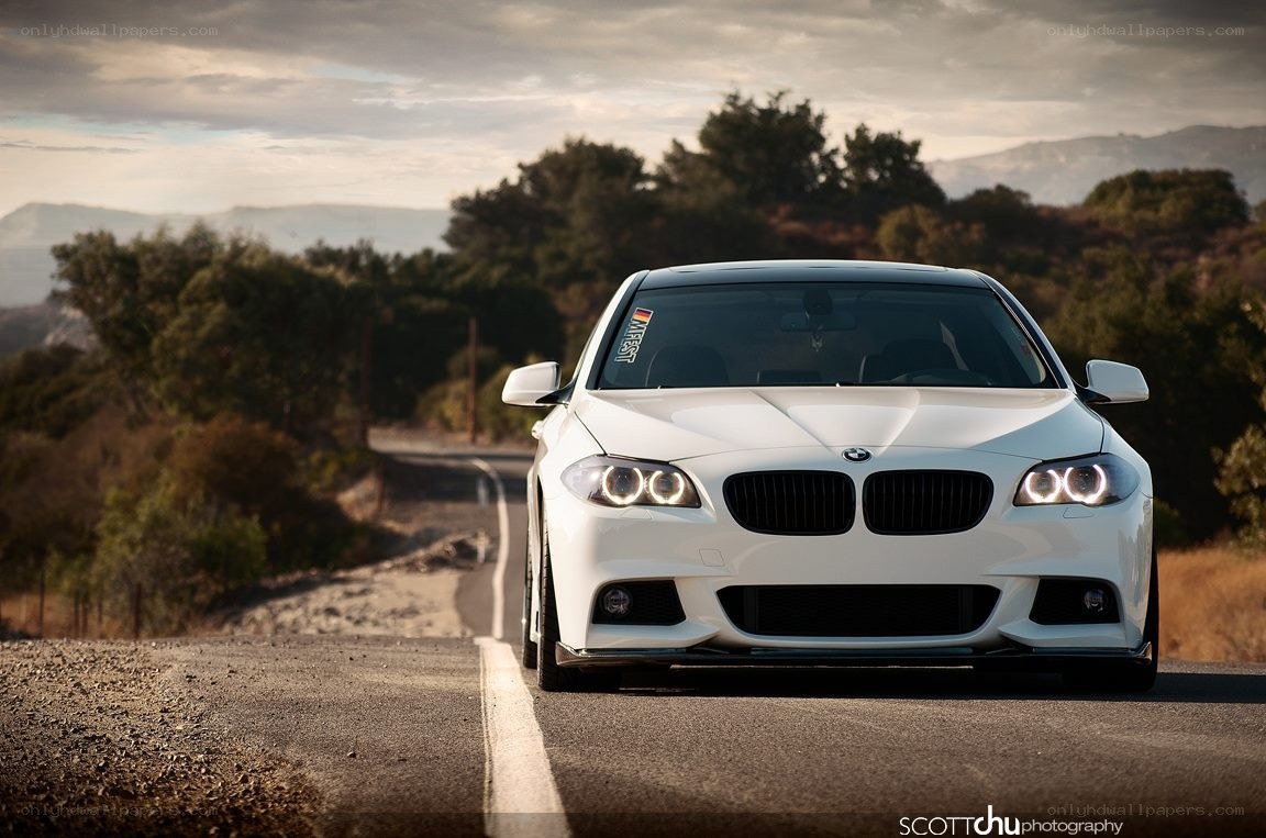 white bmw on a winding road
